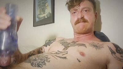 Hot tattoed redhead daddy jerks off and uses fleshligt