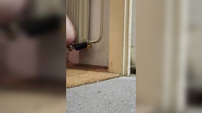 Anal chastity buttplug chained to the radiator with ice lock