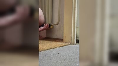 Anal chastity buttplug chained to the radiator with ice lock