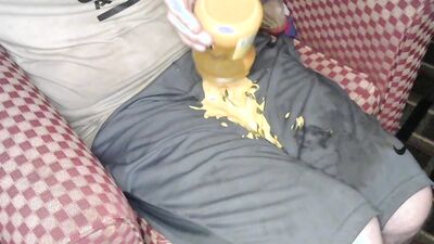 Having some hot cheese dip using nike shorts for bowl