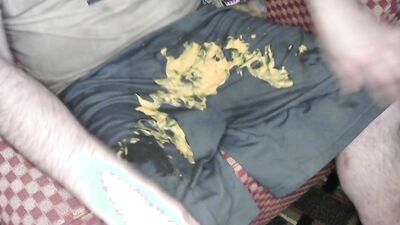 Having some hot cheese dip using nike shorts for bowl