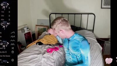 male camming model seducing viewer in his blue bedazzled superhero bodysuit (lol no homo)