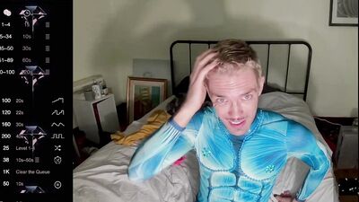 male camming model seducing viewer in his blue bedazzled superhero bodysuit (lol no homo)