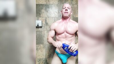 Muscle stud eats his own cum in gym shower after workout