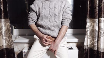 A young guy jerks off his dick and cums loudly