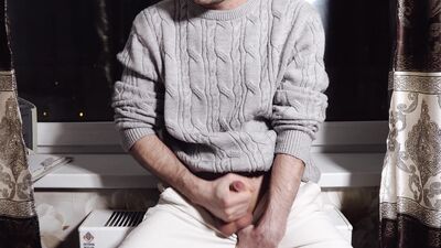 A young guy jerks off his dick and cums loudly