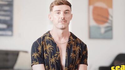 SEAN CODY - Phoenix Sheds His Clothes And Strokes His Long Curved Cock Until He Cums On The Bed