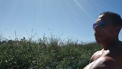 Muscular guy public masturbation at a popular park. People passing by...interrupting him! RISKY!!!