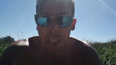 Muscular guy public masturbation at a popular park. People passing by...interrupting him! RISKY!!!