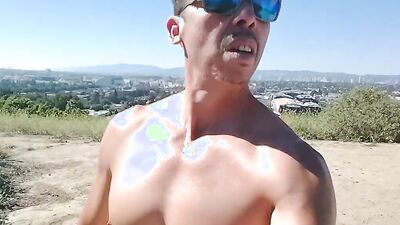 Muscular guy public masturbation at a popular park. People passing by...interrupting him! RISKY!!!