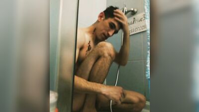 Spitting young athletic slender straight guy in tattoo takes a shower, washes his head legs penis in the bathroom toilet
