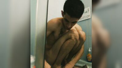 Spitting young athletic slender straight guy in tattoo takes a shower, washes his head legs penis in the bathroom toilet