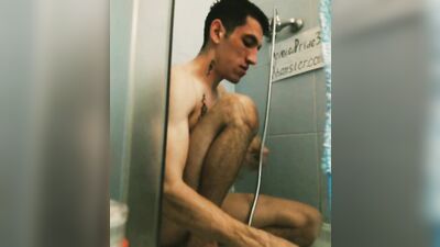 Spitting young athletic slender straight guy in tattoo takes a shower, washes his head legs penis in the bathroom toilet