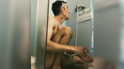 Spitting young athletic slender straight guy in tattoo takes a shower, washes his head legs penis in the bathroom toilet