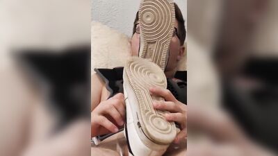 Nicely played in bed with my sneakers on the cock