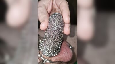 Penis chastity cage with chainmail. Can I jerkoff and cum?
