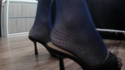 Giving a Footjob after teasing you with long toenails claws, soles, fishnets and sandals