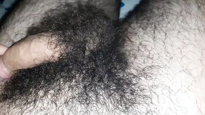 Extremely hairy young guy masturbates before sleep