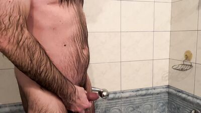 Earl bathes and soaps himself in the bathtub in the hotel bathroom