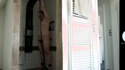 Slave echrisi tied up with dildo in shower with cum licking