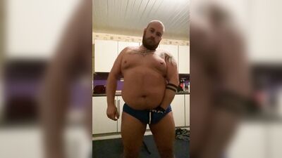 Daddy Bear strip teases wearing a jock, rides a dildo and cums