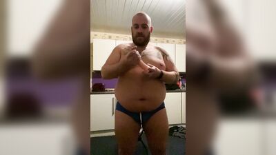 Daddy Bear strip teases wearing a jock, rides a dildo and cums