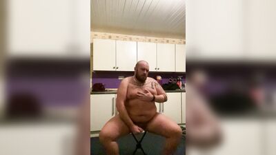 Daddy Bear strip teases wearing a jock, rides a dildo and cums