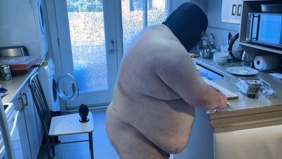 Pluged SuperChub cleans his kitchen