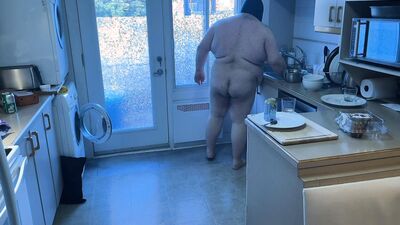 Pluged SuperChub cleans his kitchen