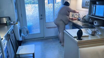 Pluged SuperChub cleans his kitchen