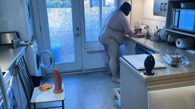 Pluged SuperChub cleans his kitchen