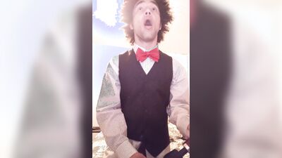 Femboy in tuxedo touches himself with doxy vibrator