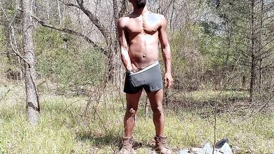 Handsome hunk going for a cumshot in the woods