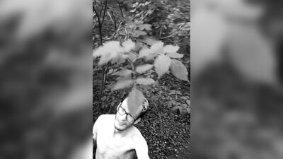 Slender man running around the forest completely naked black and white video