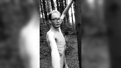 Slender man running around the forest completely naked black and white video