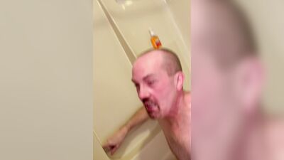 Fun in the tub with piss and cum