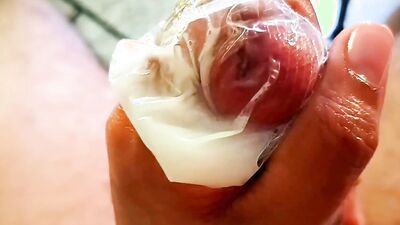 Daddy's Big Cumshot on a Condom