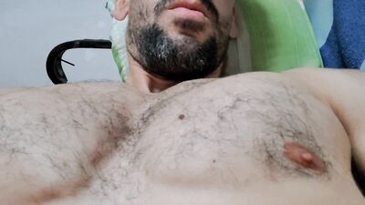 Muscle guy masturbating while watching porn