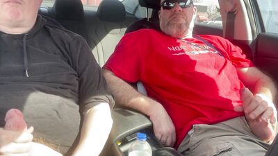 Stroking our Cocks In car in a parking lot