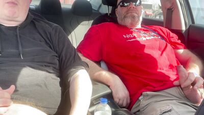Stroking our Cocks In car in a parking lot