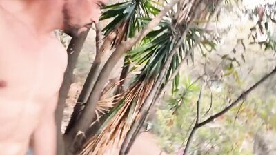 Fitness man walking fully naked on abandoned building