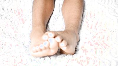 Luscious feet on a beautiful white sheet