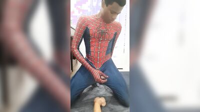 Spiderman cums while riding massive dildo