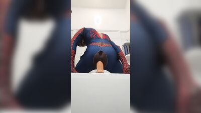 Spiderman cums while riding massive dildo