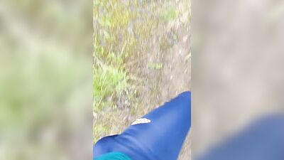 Sexy guy walks in the woods and jerks off his cock in his tight sweatpants
