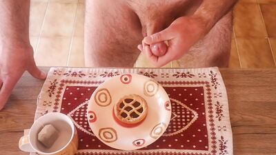 Cicci77 masturbates her beloved Pedro to produce a lot of sperm by ejaculating on a tart that he will then eat for breakfast