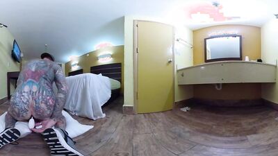 Tattooed bloke is riding his white dildo in VR video