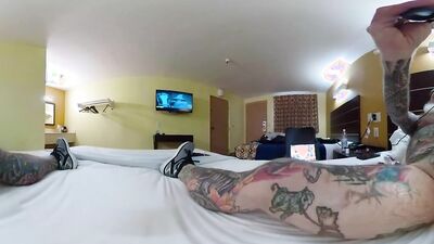 Tattooed bloke is riding his white dildo in VR video