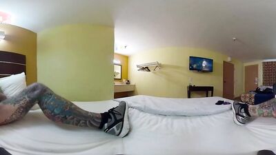Tattooed bloke is riding his white dildo in VR video