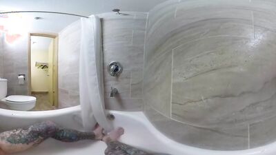 Tattooed bloke is riding his white dildo in VR video